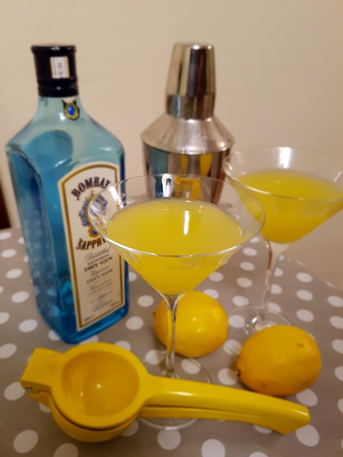 A gin cocktail alongside the ingredients
